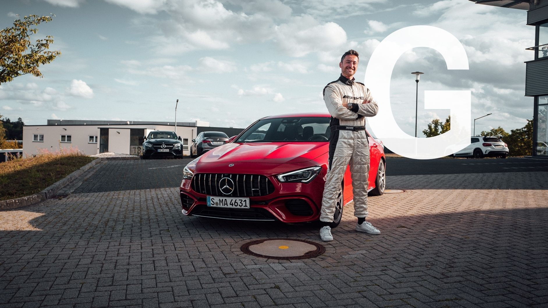 Felix in front of a Mercedes-AMG CLA 45 S