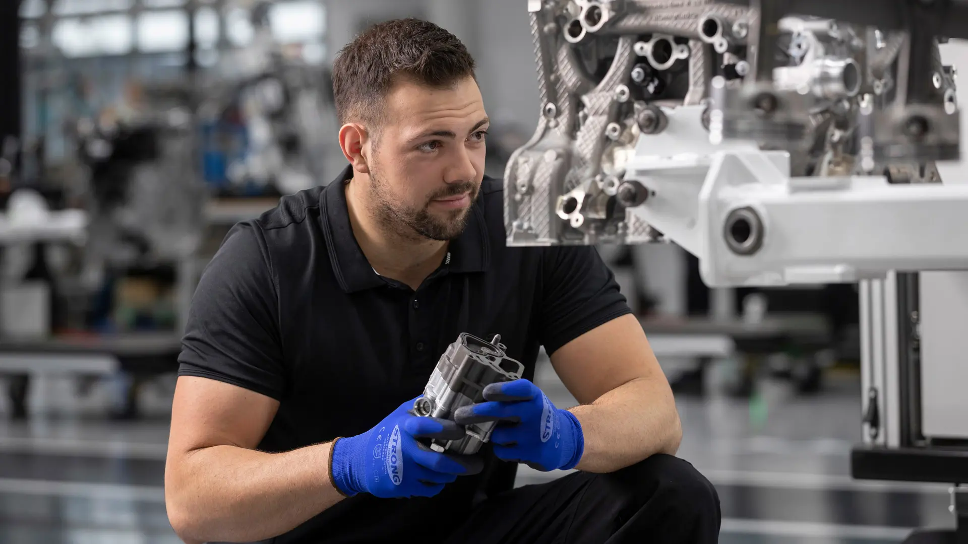 A mechanic working at today's Mercedes-AMG manufactur