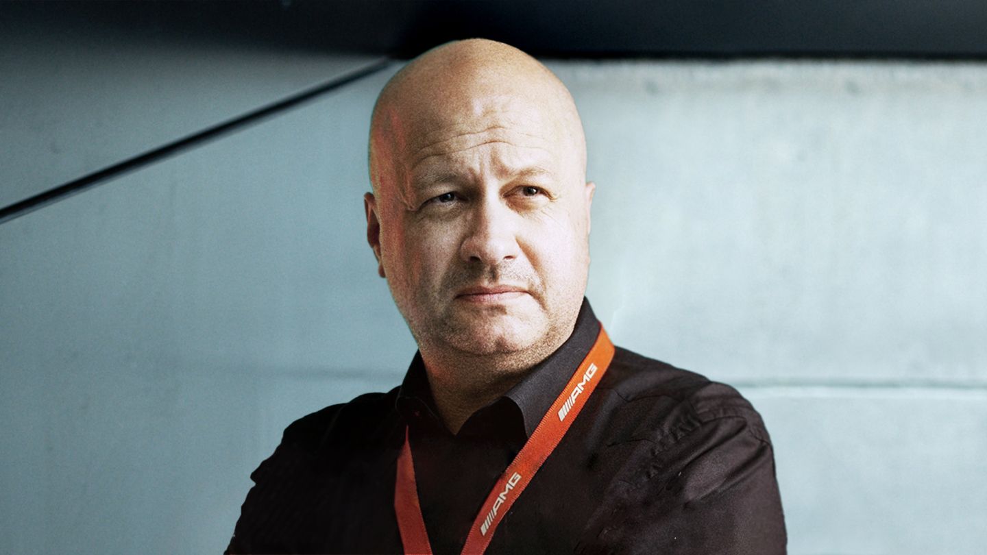 Dr. Andreas Hertweck in a black shirt with a red lanyard