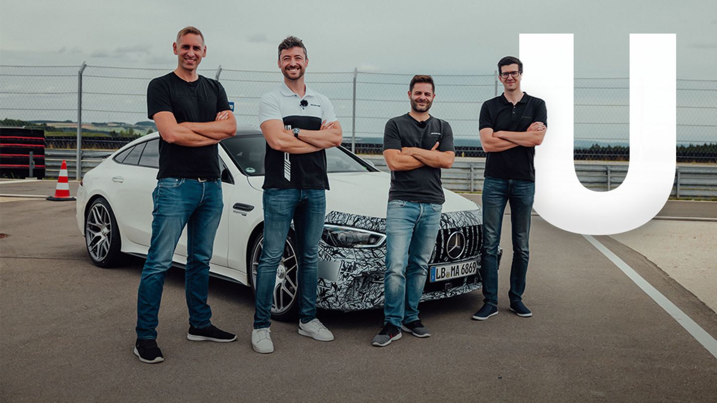 Felix with several vehicle engineers in front of a Mercedes-AMG