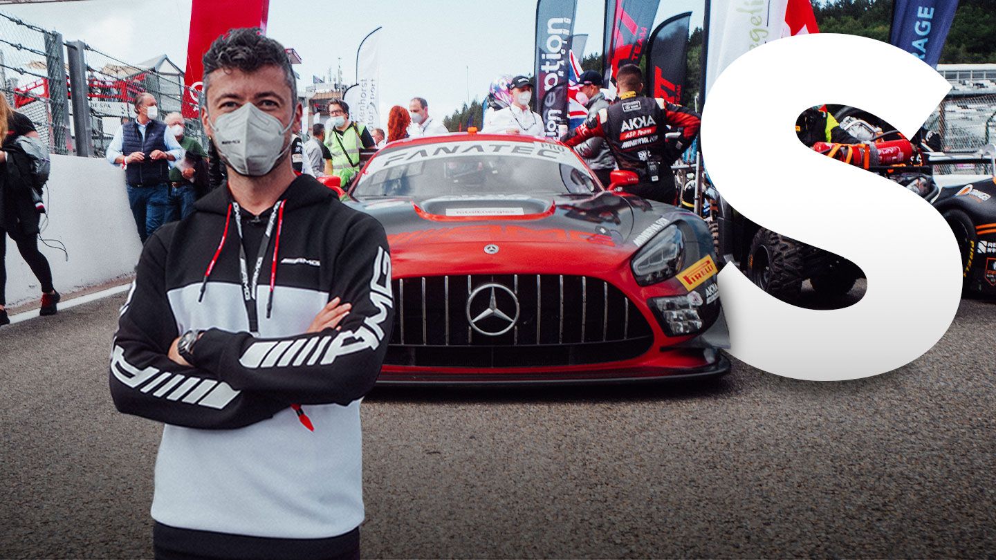 Felix in front of a Mercedes-AMG racing car