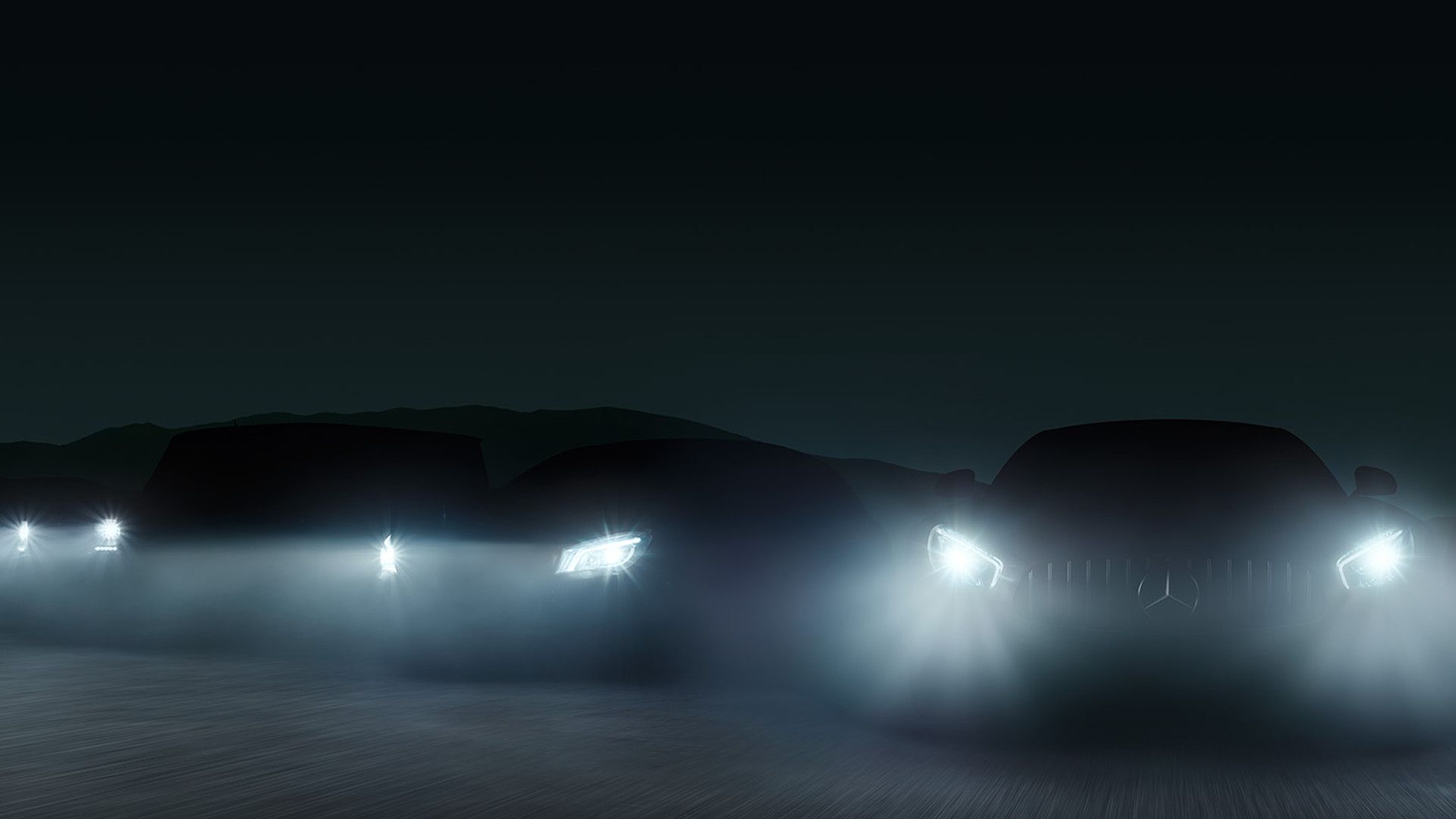 Headlights of arrayed Mercedes-AMG vehicles shining in the dark through fog