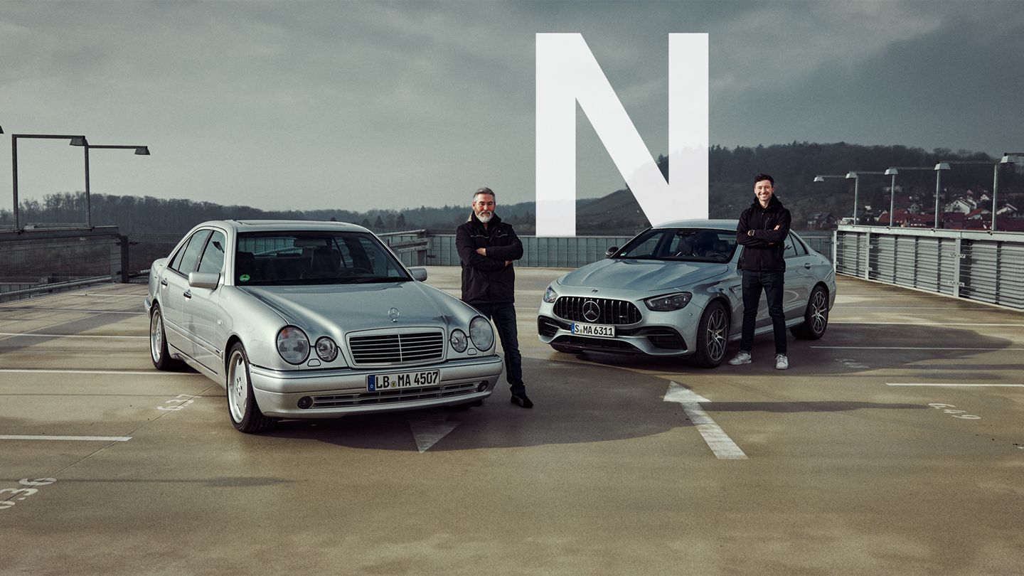 Felix and Michael next to a Mercedes-Benz E 50 AMG and a Mercedes-AMG E 63 S 4MATIC+