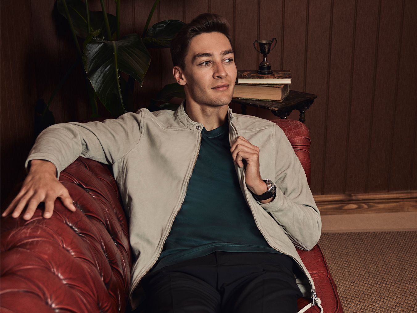 George Russel sitting on a couch