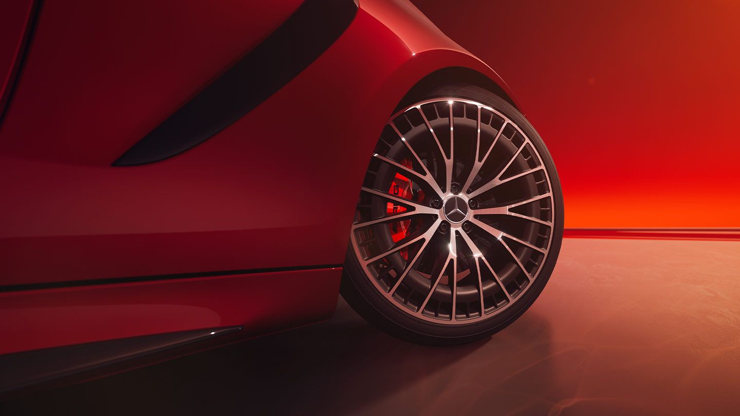 The front wheel of a Mercedes-AMG Cabriolet in focus.