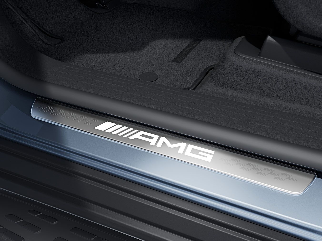 Close-up of the AMG lettering on a door sill panel.