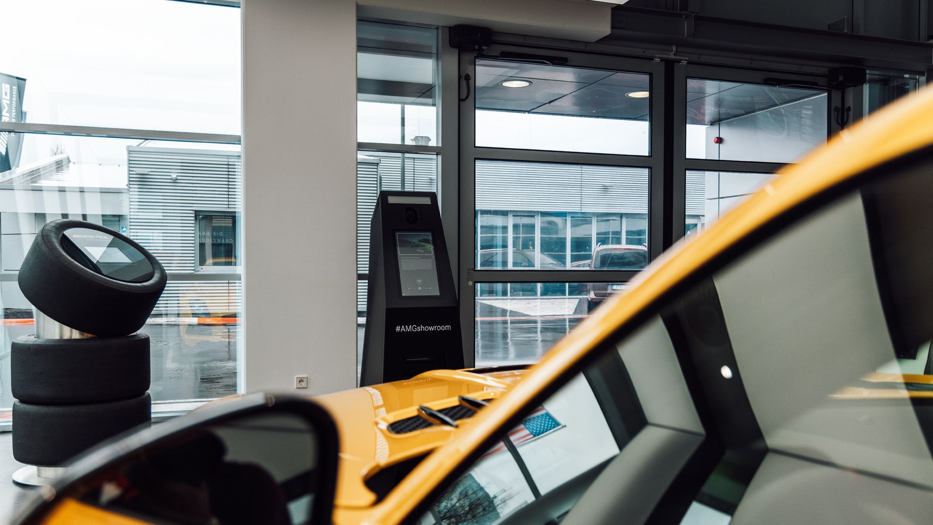 Foto from the Showroom in Affalterbach with a yellow AMG vehicle